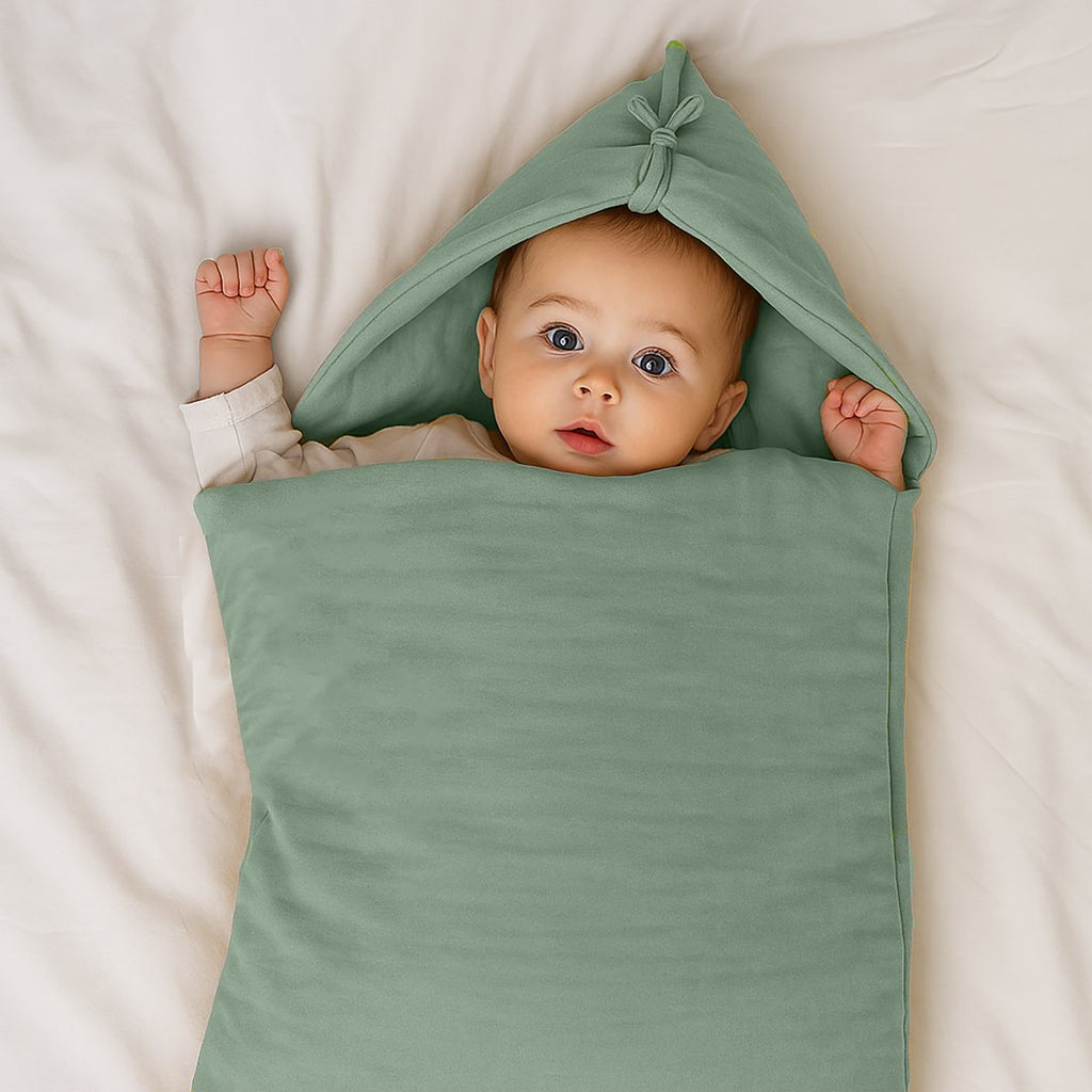 Grünes Babynest aus Bio-Baumwolle